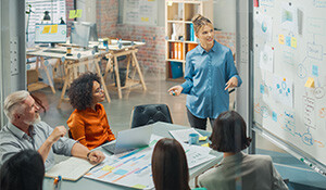 Woman leading creative planning for a team